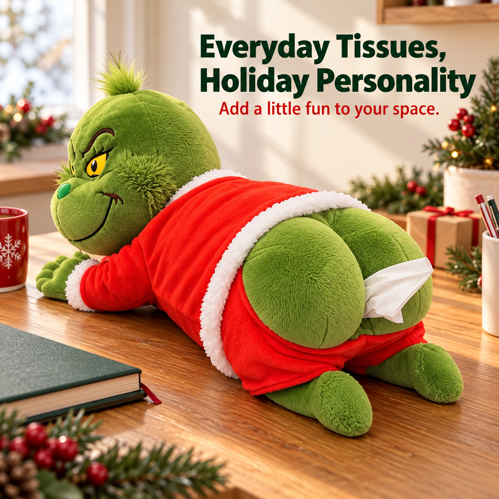 Grinch-inspired plush tissue holder displayed on a tabletop with everyday tissues and Christmas decorations