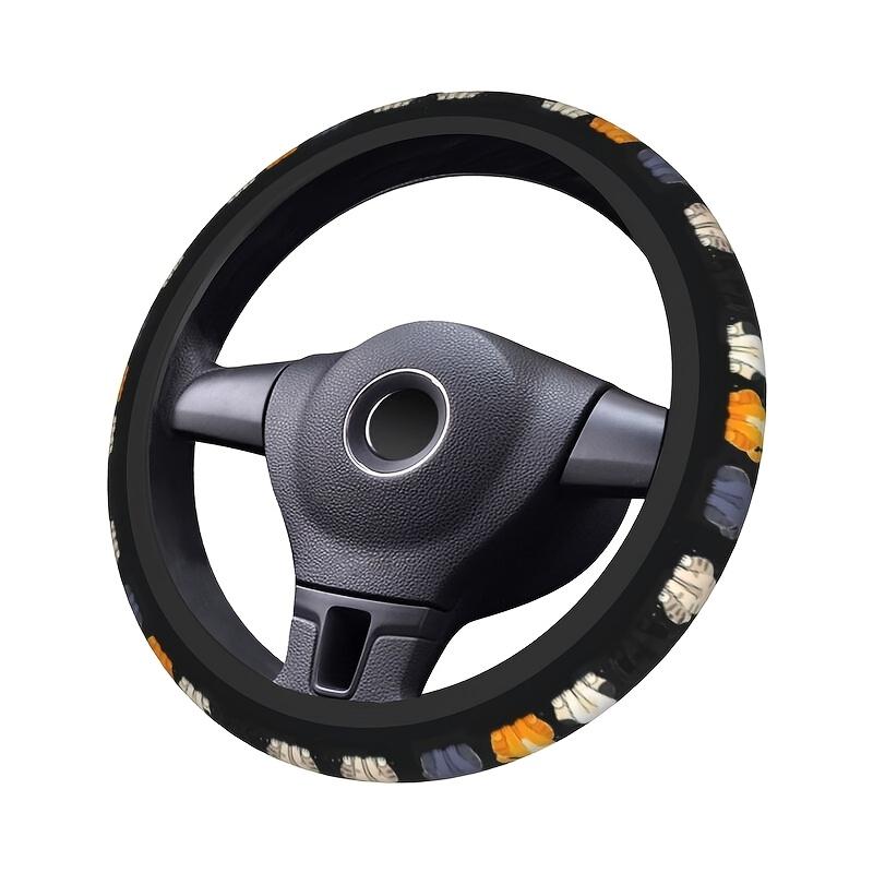Original black cat steering wheel cover shown on an example steering wheel in three-quarter view