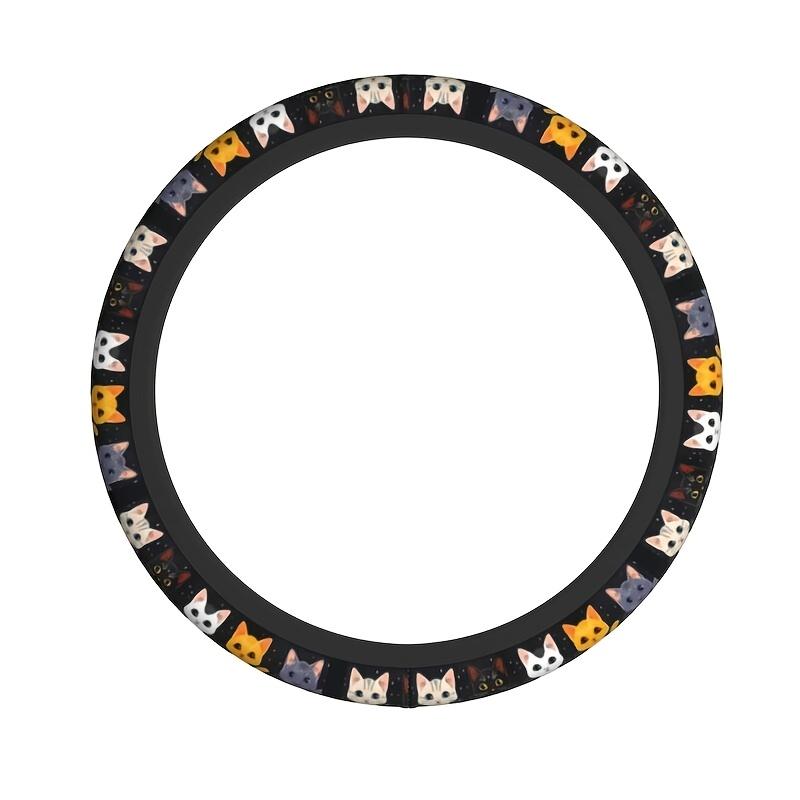 Original isolated circular black steering wheel cover with colorful white orange gray and black cat faces
