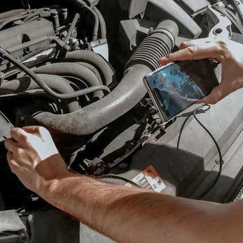 Endoscope inspection camera being used around automotive components
