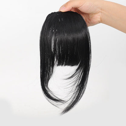 Fake bangs hairpiece for the top of the head