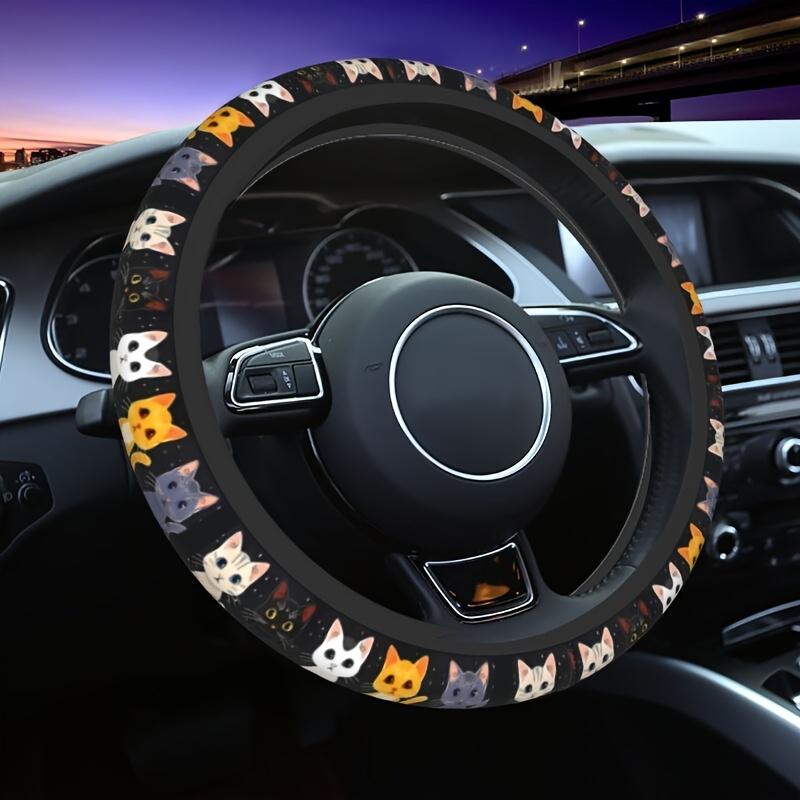 Original product photo of cat patterned steering wheel cover installed in a car during an evening drive